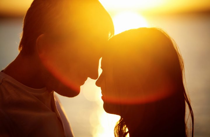 photo of young couple about to kiss